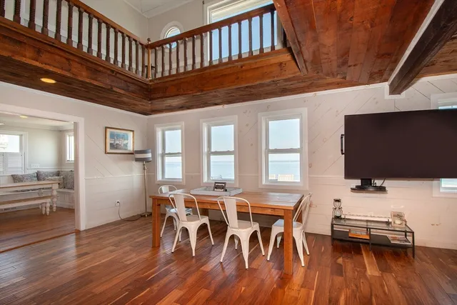 a living room with furniture a ceiling fan and a rug