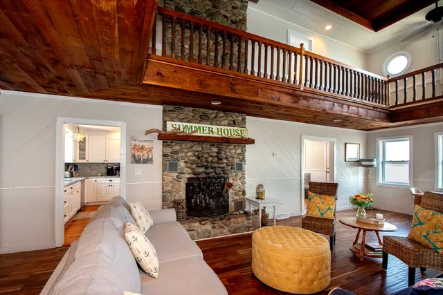 a living room with furniture or couch and a chandelier