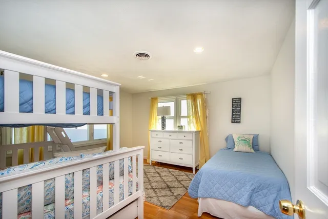 a bedroom with furniture and a window