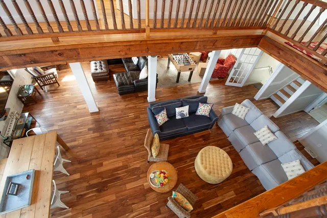 a view of a balcony with wooden floor