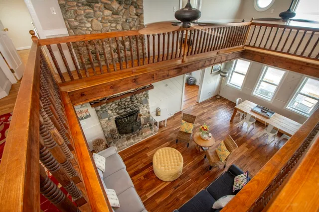 a view of a hallway with furniture