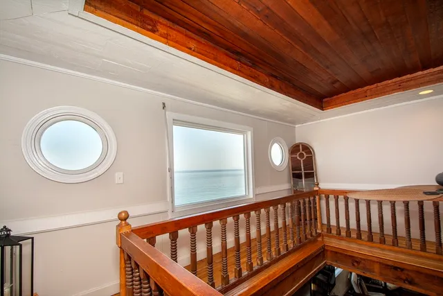 a room with gym equipment and a fireplace