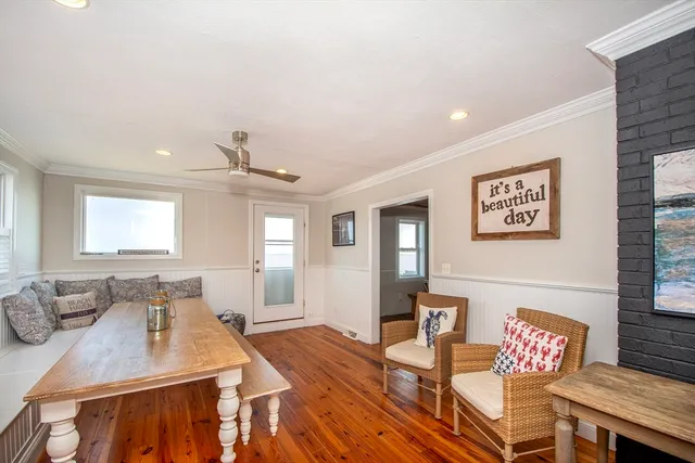a view of a dining room with furniture window and wooden floor