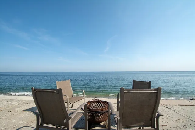 a terrace of a house with outdoor seating