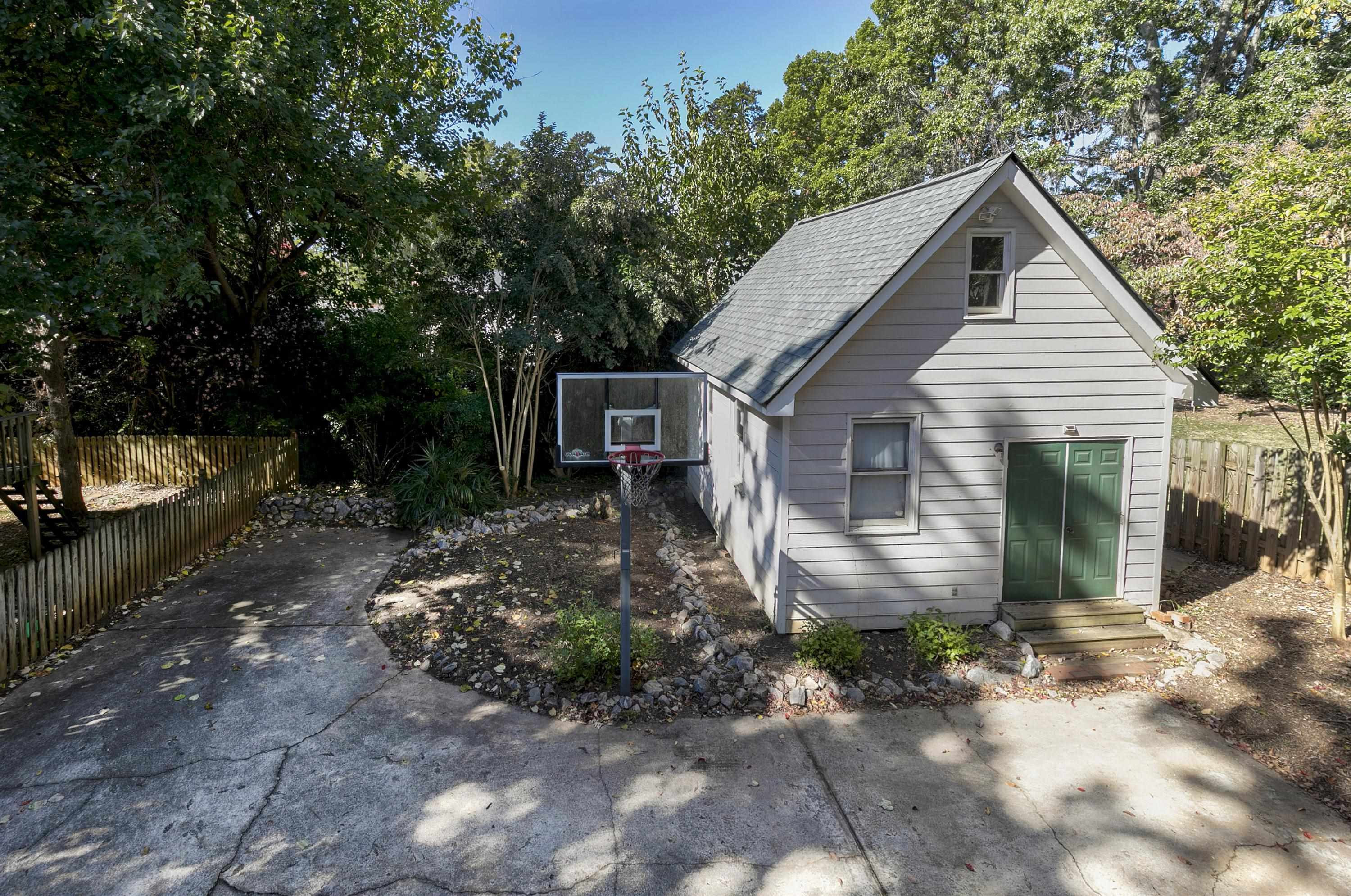 411 Dixie Trail Raleigh, NC 27607 - Photo 30 of 38 Detached workshop, perfect for storage! This detached building can be converted to a "Tiny House" for added income production property. See "Tiny House" renditions in photos Workshop