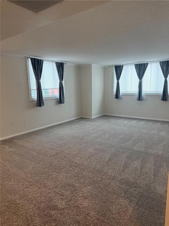 43 South 9th Street, Unit 403 Indiana, PA 15701 - Photo 11 of 14 a view of an empty room with window and dresser
