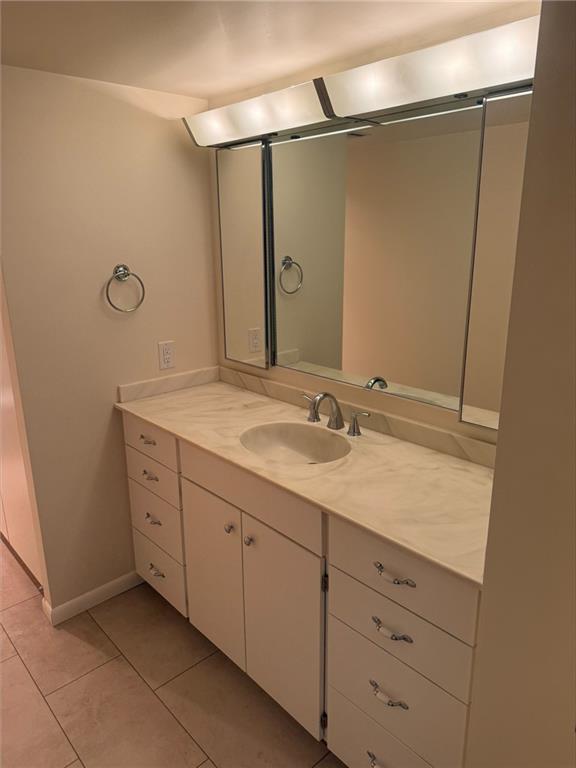 43 South 9th Street, Unit 403 Indiana, PA 15701 - Photo 13 of 14 a bathroom with a granite countertop sink and mirror