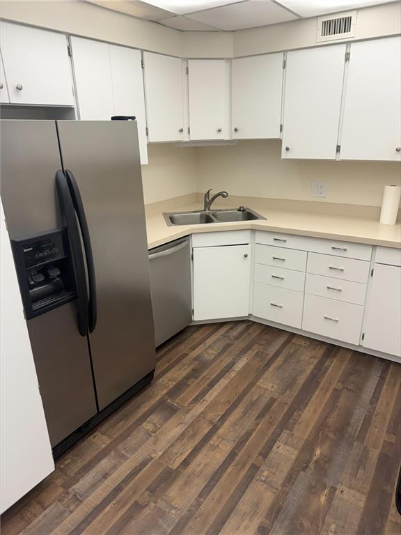 43 South 9th Street, Unit 403 Indiana, PA 15701 - Photo 2 of 14 a kitchen with stainless steel appliances white cabinets and a refrigerator