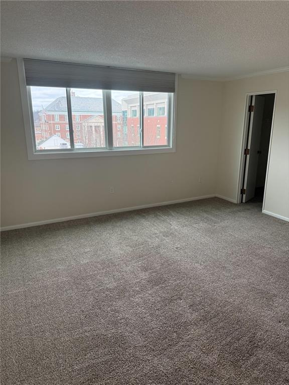 43 South 9th Street, Unit 403 Indiana, PA 15701 - Photo 8 of 14 an empty room with windows