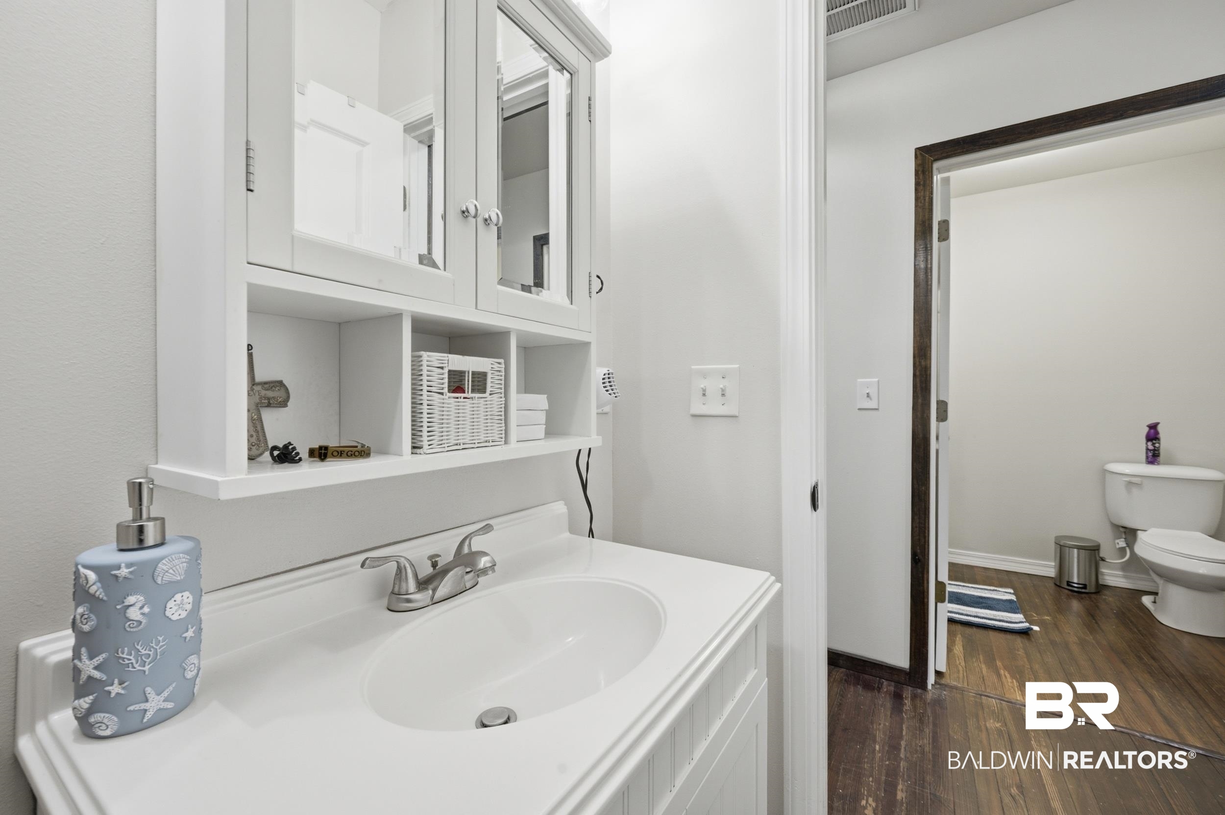 42080 Bayou Road Bay Minette, AL 36507 - Photo 21 of 43 White vanity with an integrated sink and brushed nickel faucet