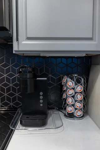 a bathroom with a granite countertop sink toilet a mirror and shower