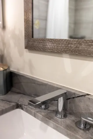 a kitchen with a sink and a stove top oven