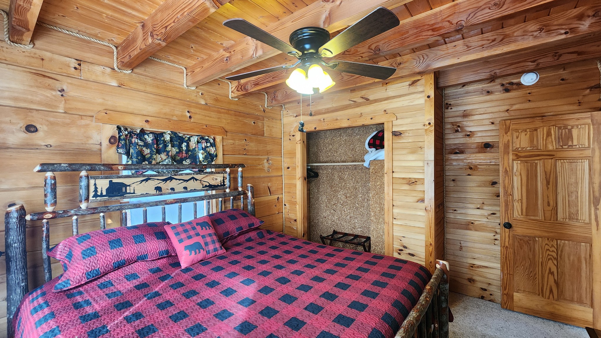 5615 Eastport Road Alpine, TN 38543 - Photo 4 of 83 a bedroom with a bed and a walk in closet