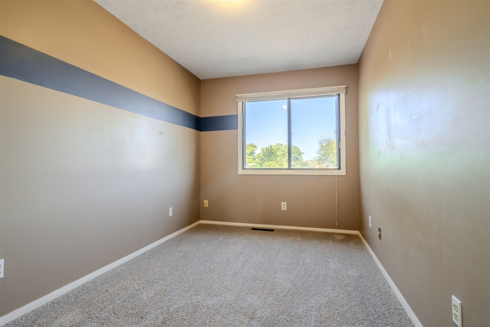 1402 Keller Road, Unit 4 Normal, IL 61761 - Photo 13 of 26 an empty room with windows