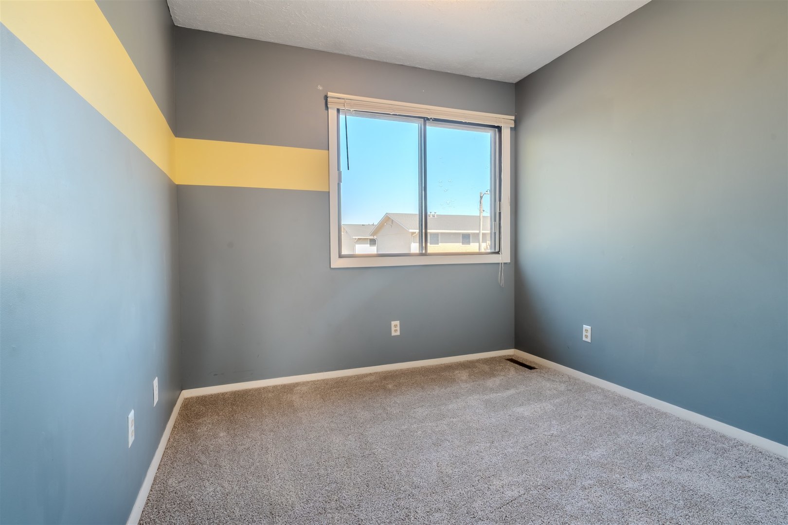 1402 Keller Road, Unit 4 Normal, IL 61761 - Photo 14 of 26 a view of an empty room with a window