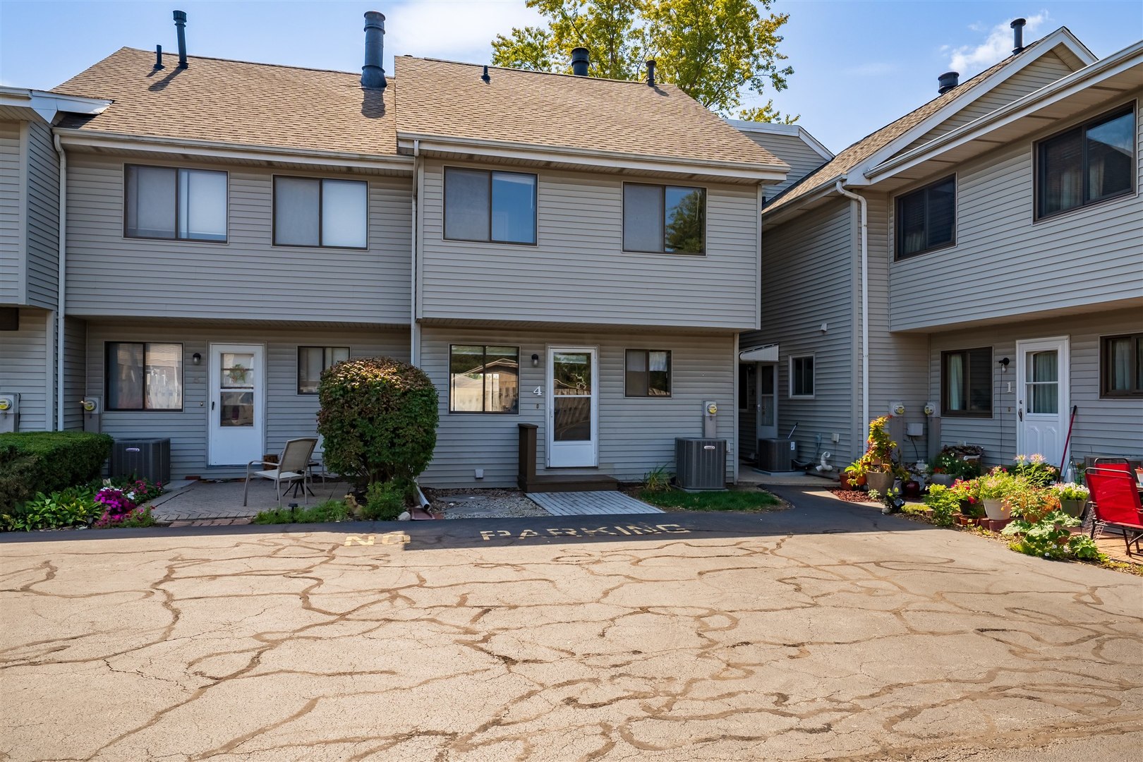 1402 Keller Road, Unit 4 Normal, IL 61761 - Photo 24 of 26 a front view of a house with a yard outdoor seating and barbeque oven
