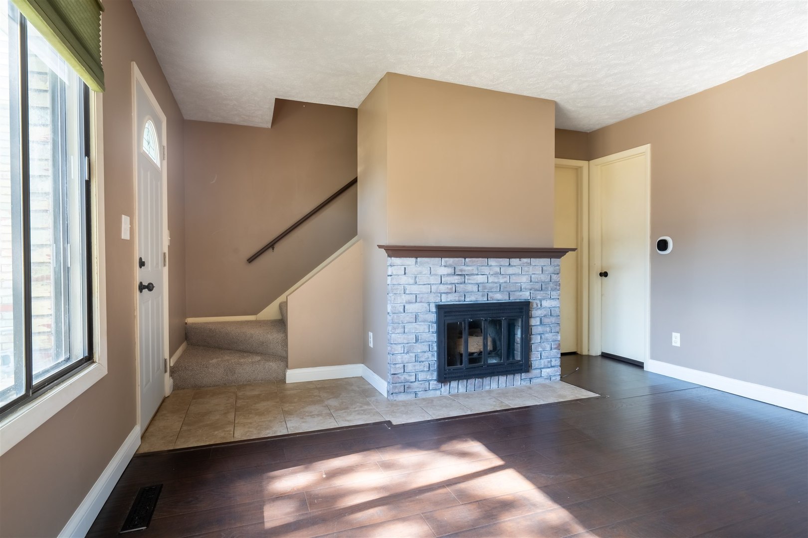 1402 Keller Road, Unit 4 Normal, IL 61761 - Photo 3 of 26 a living room with furniture and a fireplace