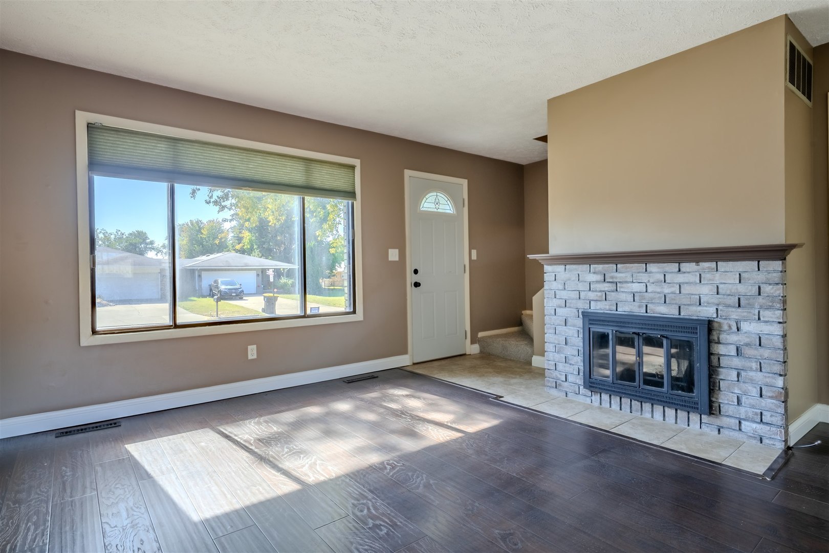 1402 Keller Road, Unit 4 Normal, IL 61761 - Photo 4 of 26 a living room with fireplace and a fireplace