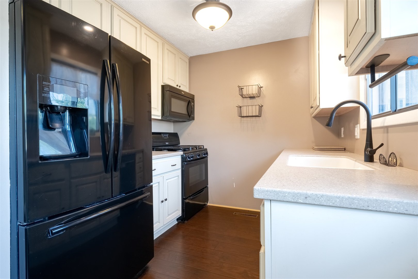 1402 Keller Road, Unit 4 Normal, IL 61761 - Photo 8 of 26 a kitchen with a refrigerator and a sink