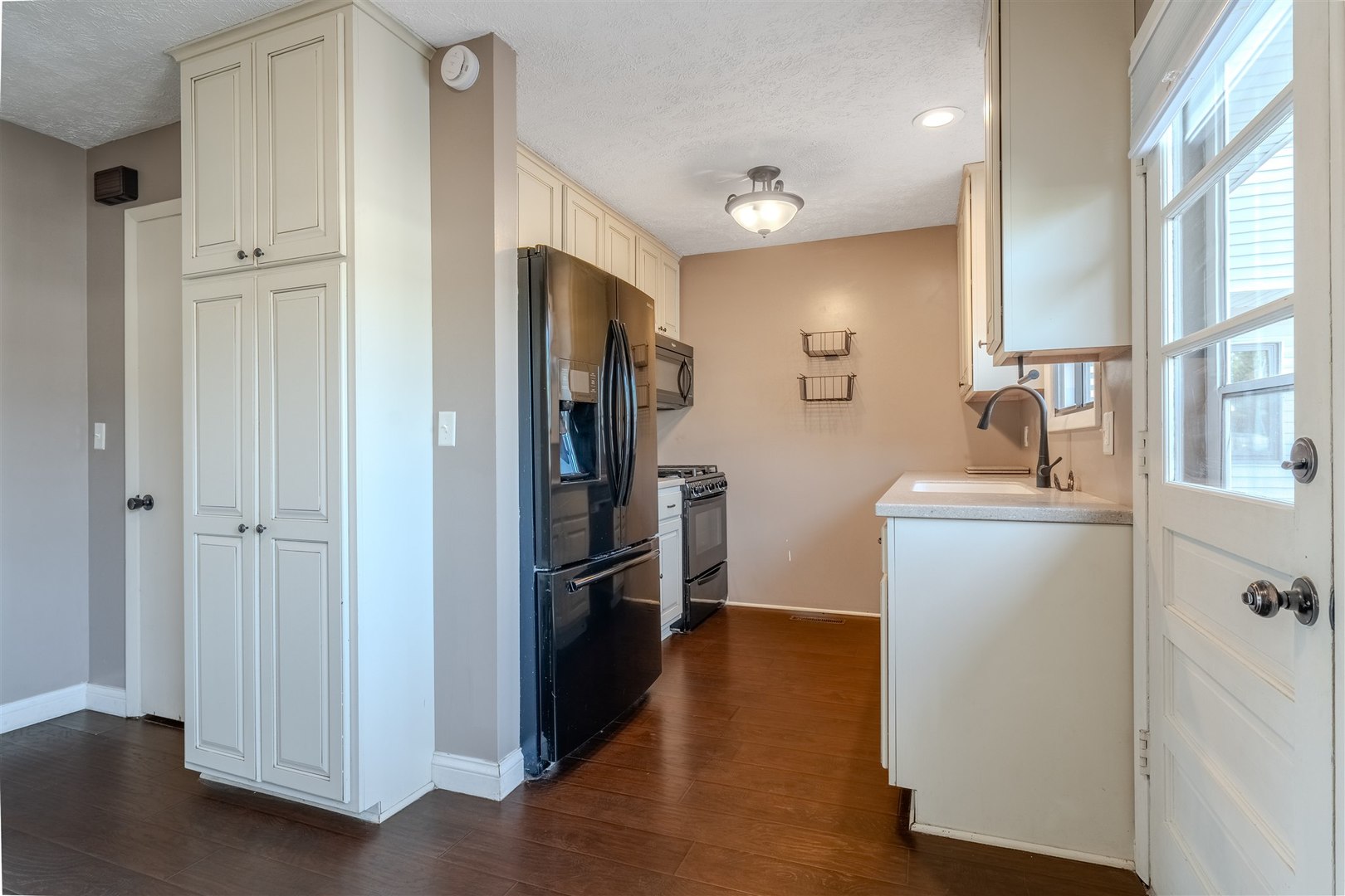 1402 Keller Road, Unit 4 Normal, IL 61761 - Photo 10 of 26 a kitchen with a refrigerator and a sink