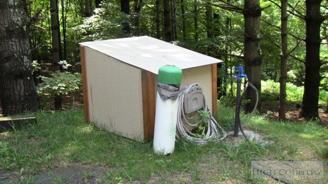 1174 Orchard Road Deep Gap, NC 28618 - Photo 4 of 7 a backyard of a house with lots of green space