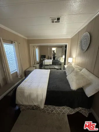 a bed room with a bed and a window