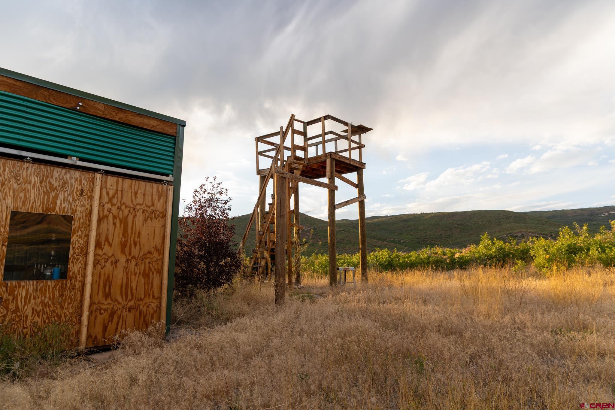 0 Currant Crk Road Cedaredge, CO 81413 - Photo 20 of 35 a view of a lake with a mountain