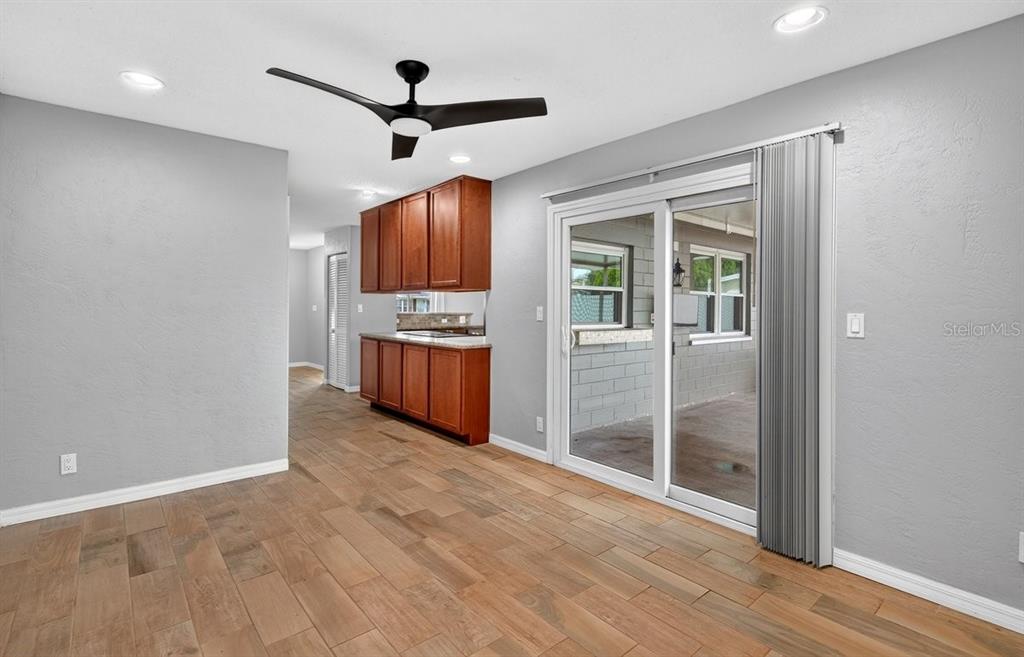 1309 Suwanee Road Daytona Beach, FL 32114 - Photo 11 of 33 a view of empty room with wooden floor and ceiling fan
