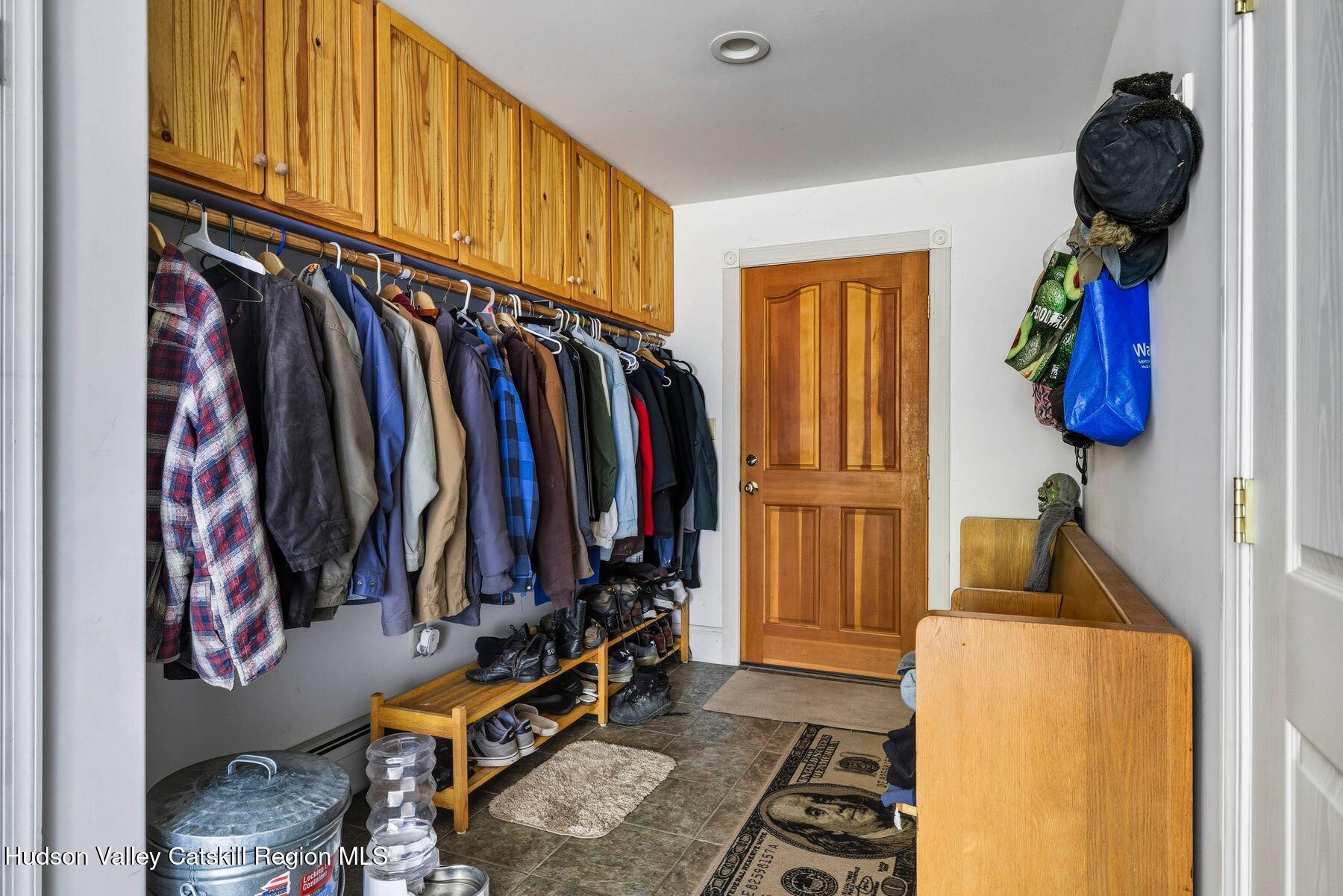 74 Bellevue Road Highland, NY 12528 - Photo 25 of 65 a view of walk in closet with clothes and shoes