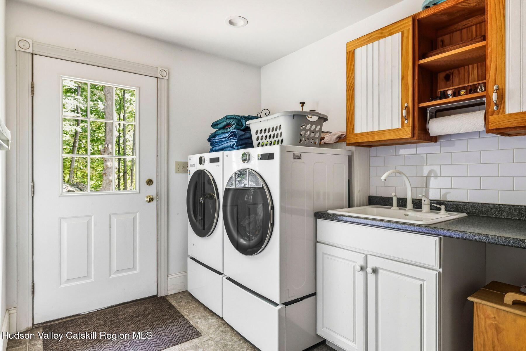 74 Bellevue Road Highland, NY 12528 - Photo 29 of 65 a utility room with sink dryer and washer