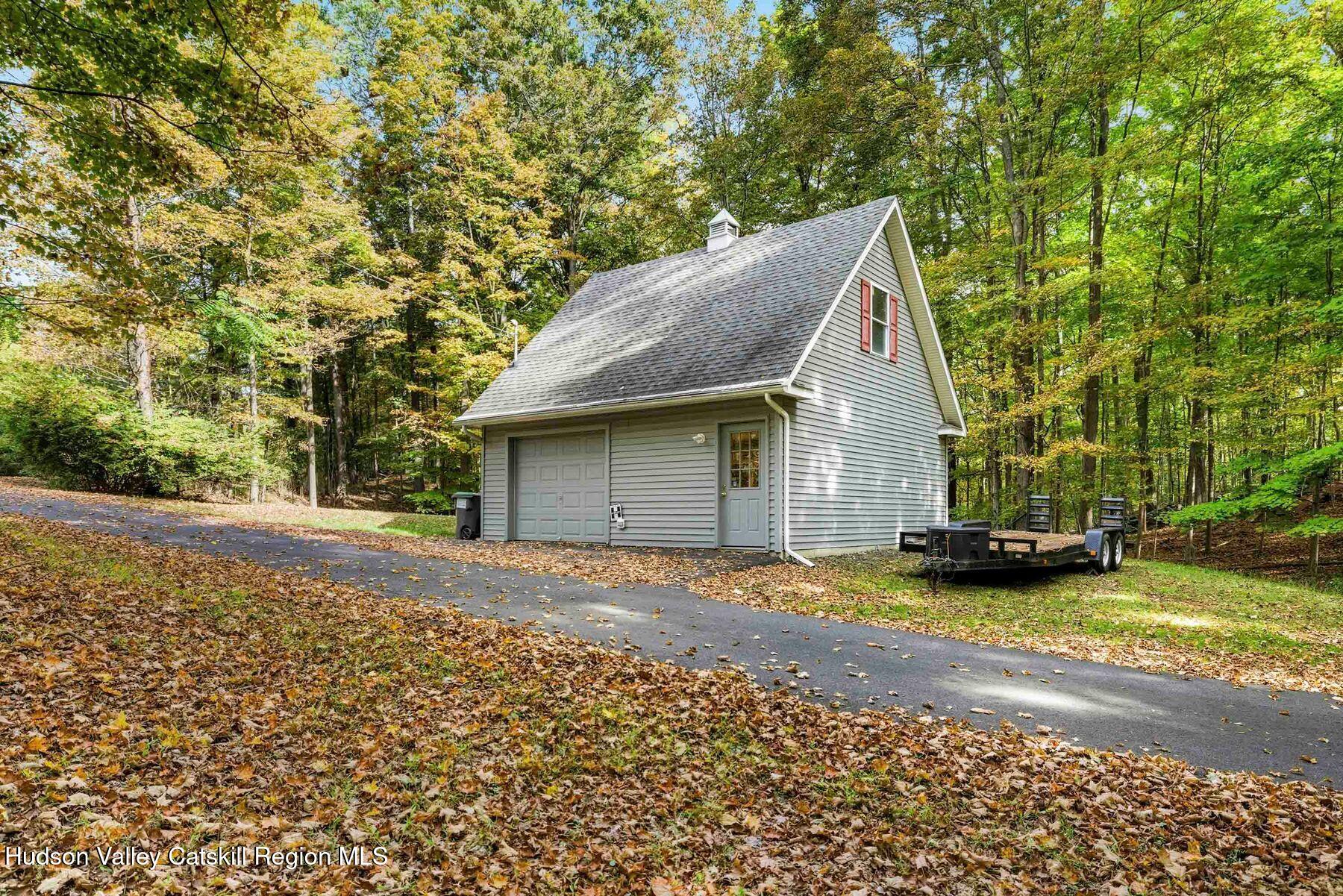 74 Bellevue Road Highland, NY 12528 - Photo 32 of 65 a view of a house with a yard and garage
