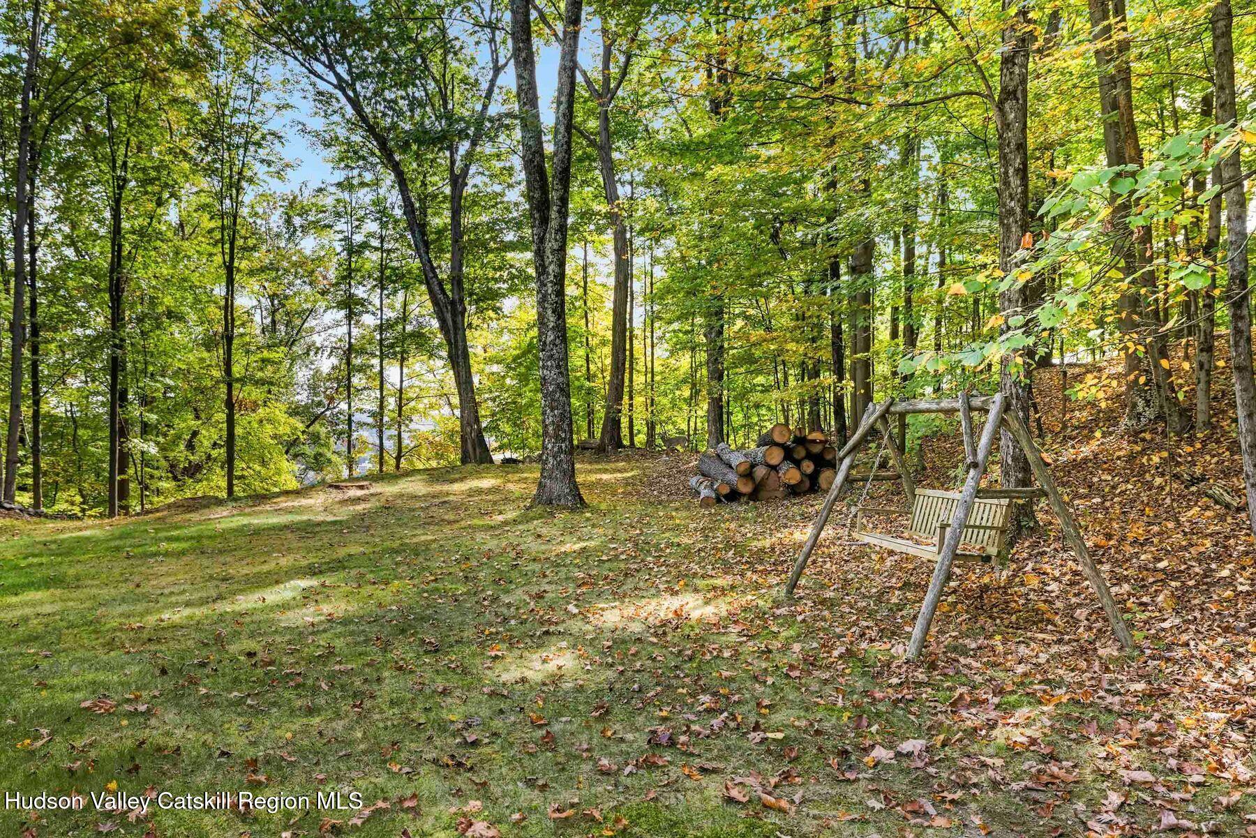 74 Bellevue Road Highland, NY 12528 - Photo 35 of 65 a view of a yard with plants and trees