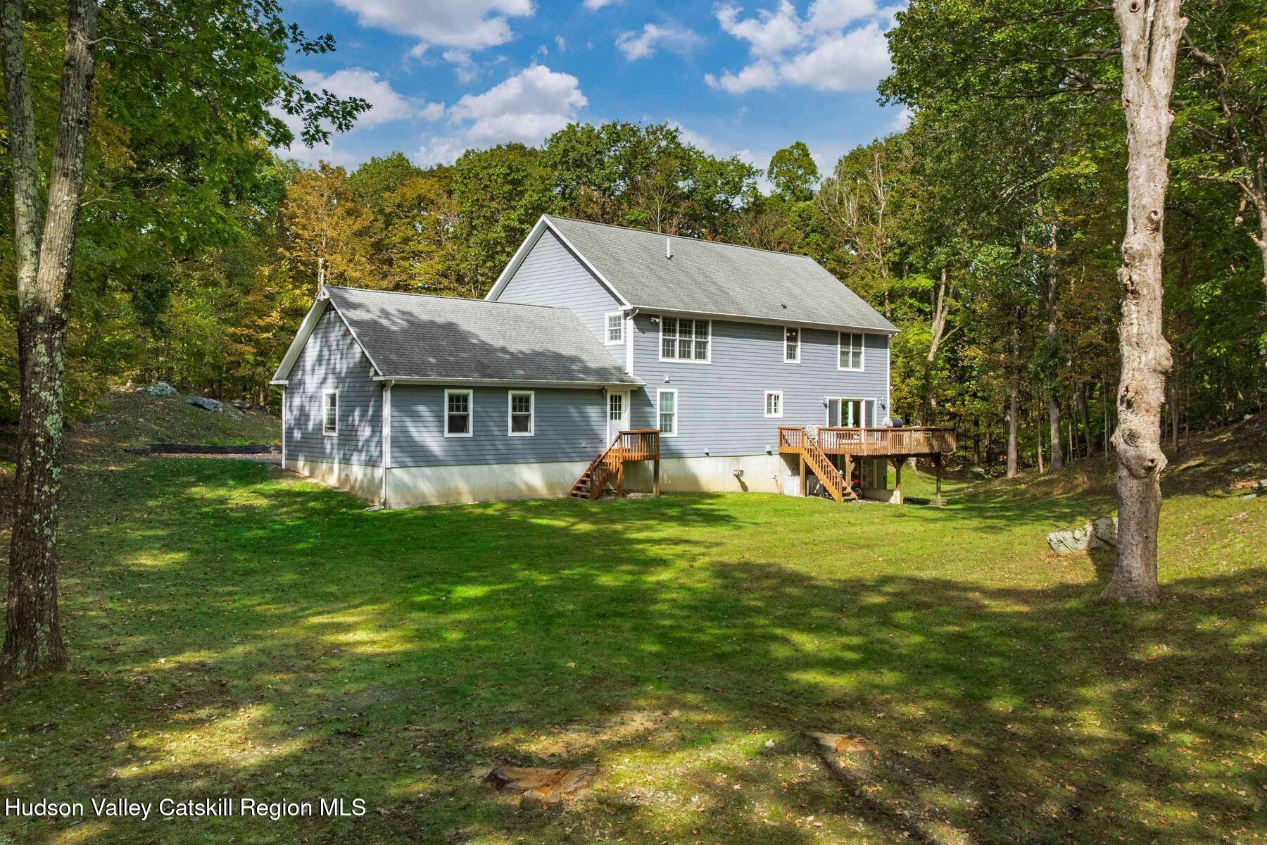 74 Bellevue Road Highland, NY 12528 - Photo 44 of 65 a view of a house with a big yard potted plants and large tree