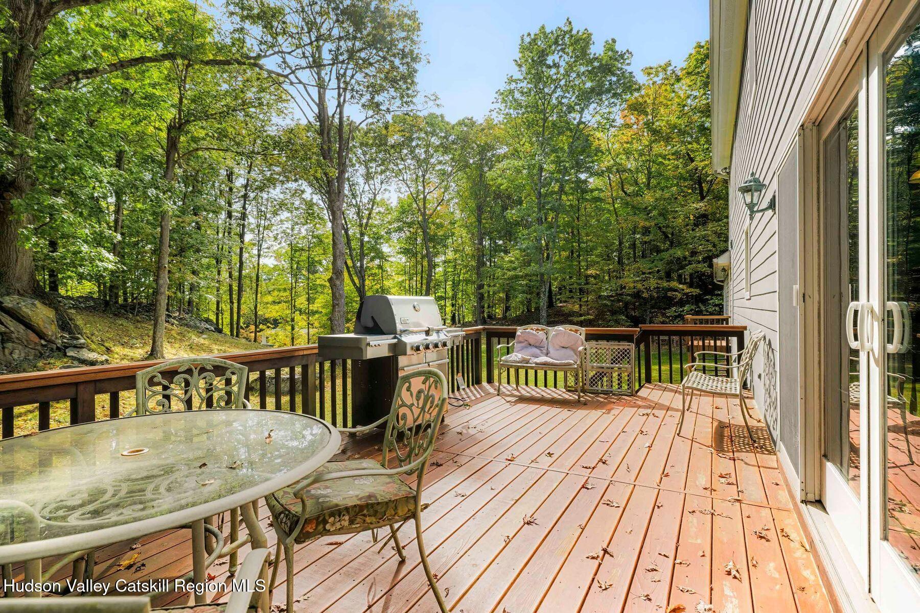 74 Bellevue Road Highland, NY 12528 - Photo 59 of 65 a view of balcony with furniture and wooden floor