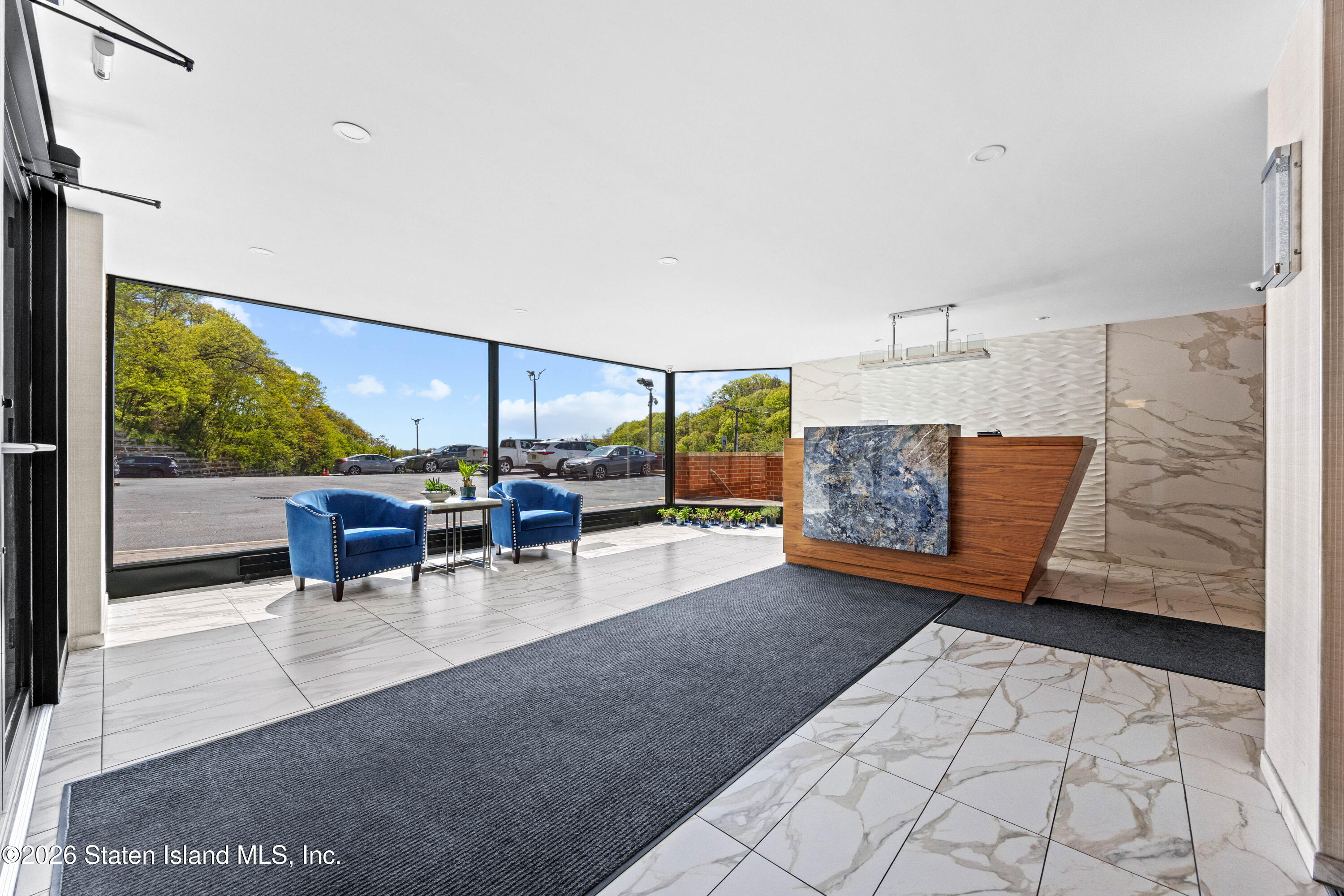 755 Narrows Road North, Unit 1014 Staten Island, NY 10304 - Photo 18 of 24 a view of a patio with dining table and chairs