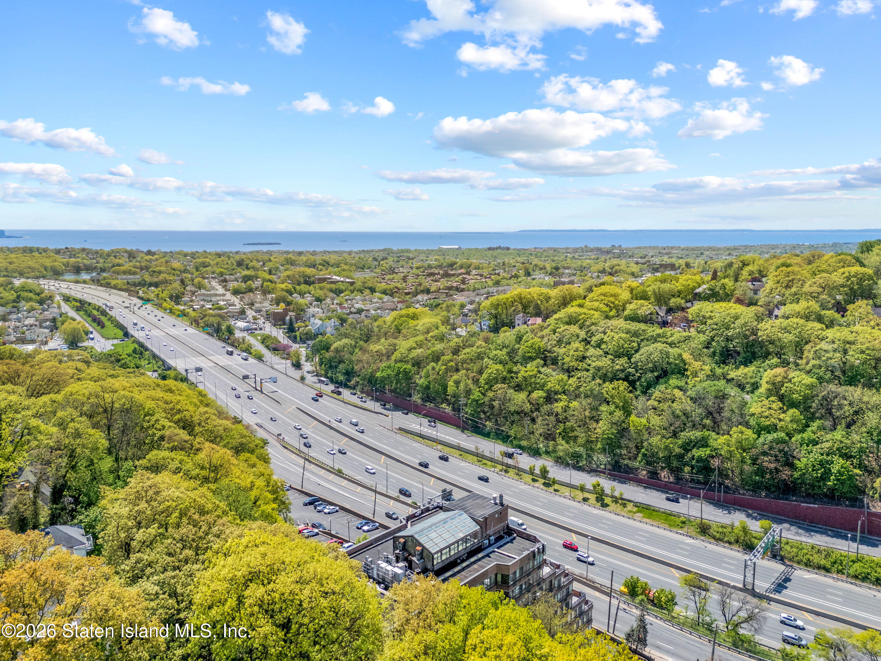 755 Narrows Road North, Unit 1014 Staten Island, NY 10304 - Photo 24 of 24 a view of a yard with an ocean view