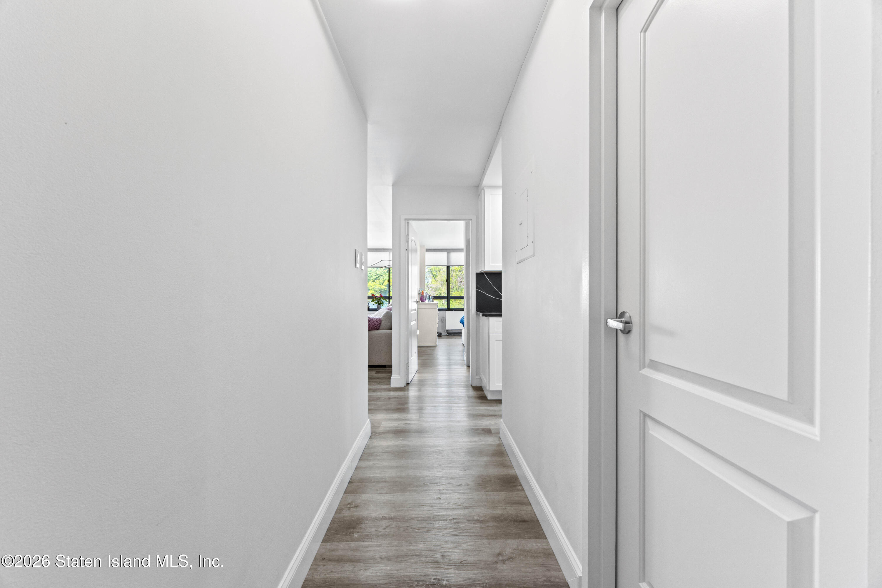 755 Narrows Road North, Unit 1014 Staten Island, NY 10304 - Photo 3 of 24 a view of a hallway with the wooden floor