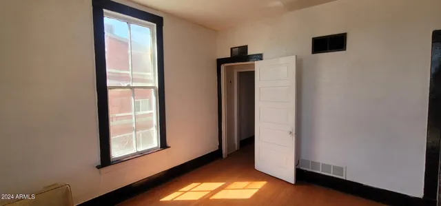 a view of front door with wooden floor