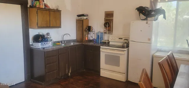 a kitchen with cabinets and appliances
