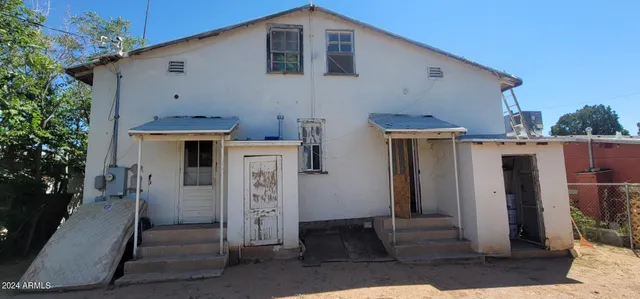 a balcony with wooden floor and outdoor space