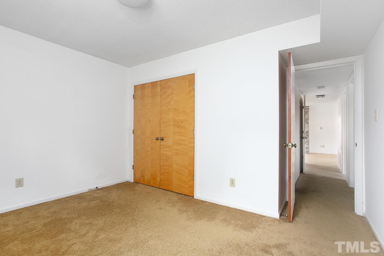 6324 Rushingbrook Drive Raleigh, NC 27612 - Photo 11 of 17 a view of an empty room