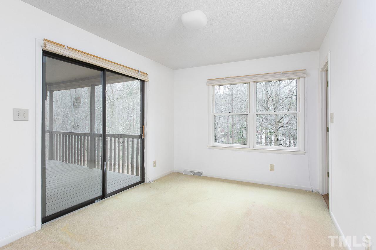 6324 Rushingbrook Drive Raleigh, NC 27612 - Photo 5 of 17 an empty room with a window