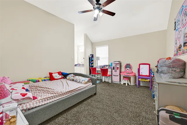 a bedroom with furniture and a bed