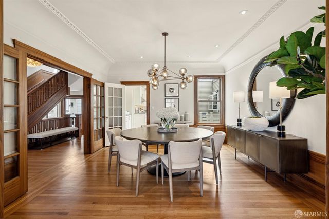 a view of a dining room with furniture window and wooden floor