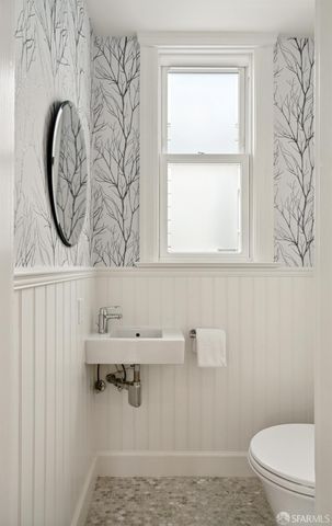 a bathroom with a toilet and a sink