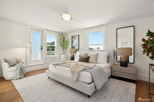 a spacious bedroom with a bed and a couch