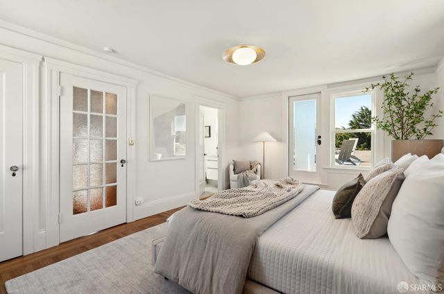 a bedroom with a bed and a couch