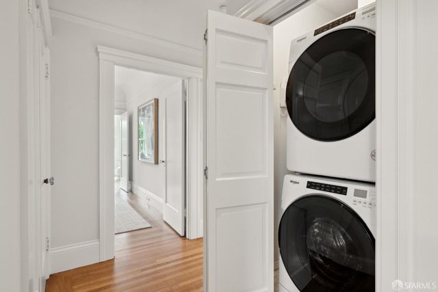 a view of a hallway with washer and dryer