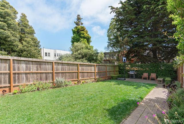 a view of a backyard with a garden