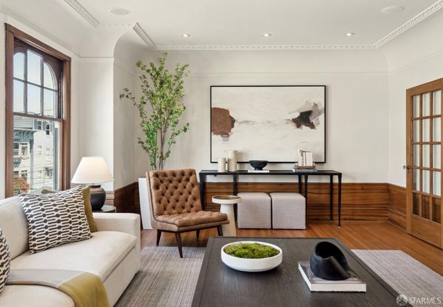 a living room with furniture and a table